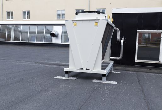 A whole ventilation system on a roof top with some pipes