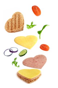 Heart shape andwich ingredients falling into place 