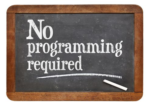 No programming required sign - white chalk text  on a vintage slate blackboard