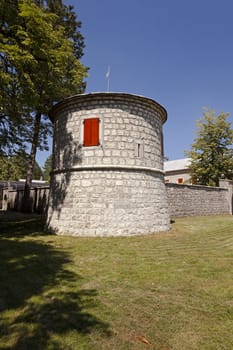  a tower with red shutters monastery, located in Cetinje, Montenegro