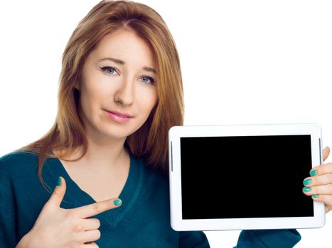 Beautiful woman holding a tablet computer and showing on black screen, isolated over a white background
