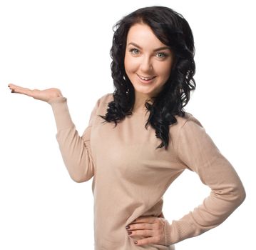 Beautiful woman showing something on the palm of her hand, isolated over white