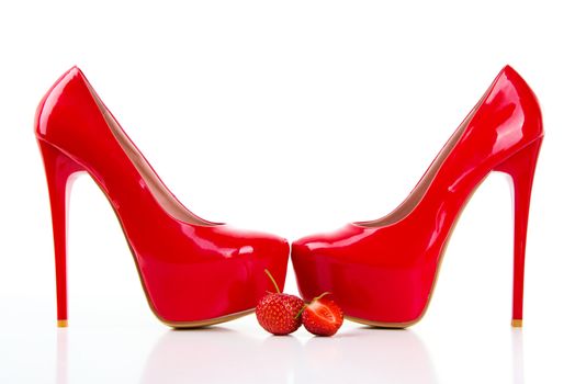 Red high heel women shoes with strawberry on white background