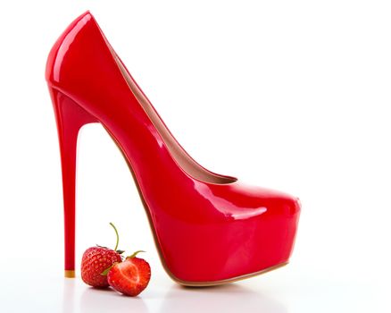 Red high heel women shoes with strawberry on white background