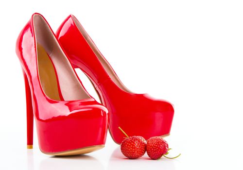 Red high heel women shoes with strawberry on white background