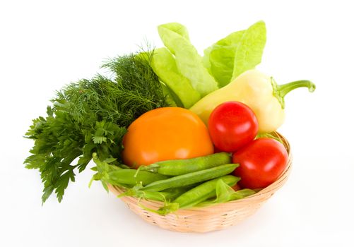 Fresh vegetables in the basket isolated on white background