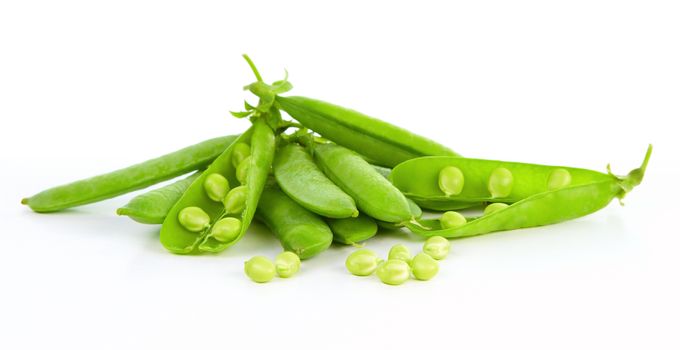 Fresh green peas isolated on a white background