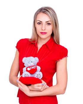 Beautiful girl in red clothes with Valentine bear, isolated on white background
