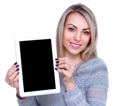 Young cheerful woman is showing blank tablet, isolated over white
