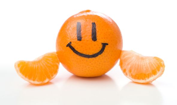 Smiling orange mandarin or tangerine fruit  isolated on white background