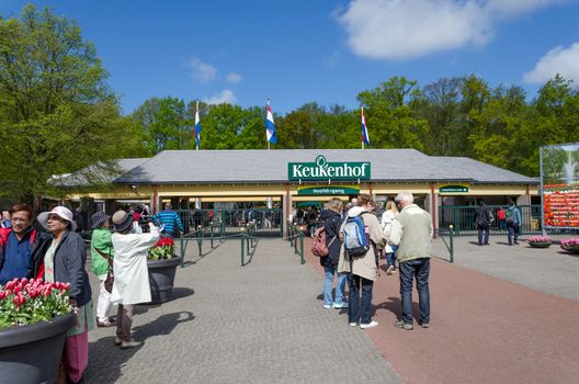 Lisse, Netherlands - May 7, 2015: Tourists at the Entrance into the Keukenhof Garden on May 7, 2015. Keukenhof is the most beautiful spring garden in the world.