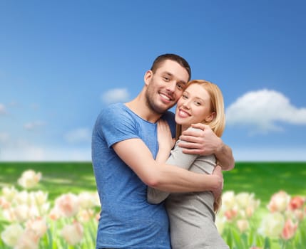 love and family concept - smiling couple hugging