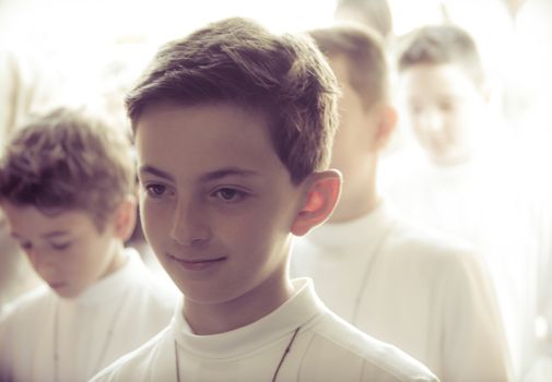 a child receiving the religious sacrament of the first communion