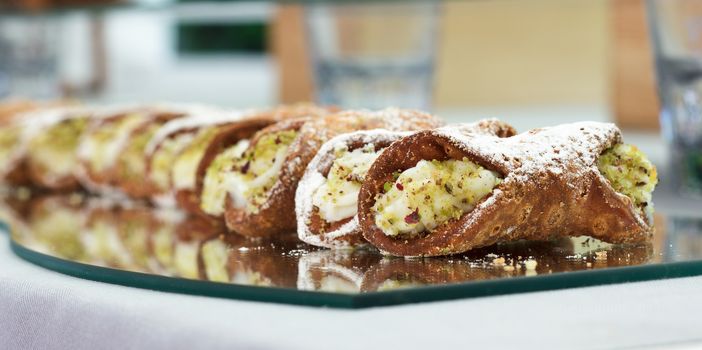 Typical Sicilian dessert with cream cheese in crunchy waffles