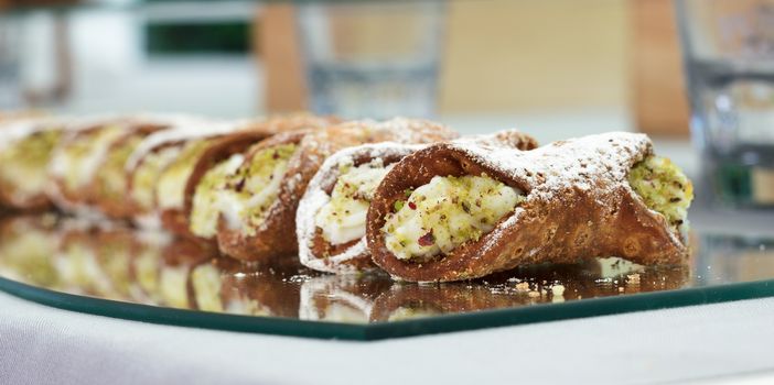 Typical Sicilian dessert with cream cheese in crunchy waffles