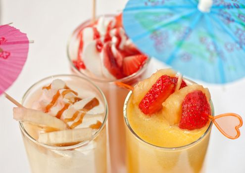 Set of three healthy nonalcoholic cocktails from berries banana and ice cream
