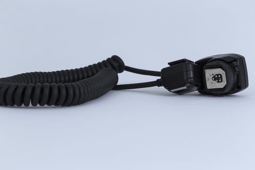 A cord based extender for flash and camera