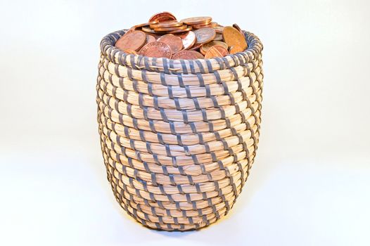 coins in basket and british banknotes
