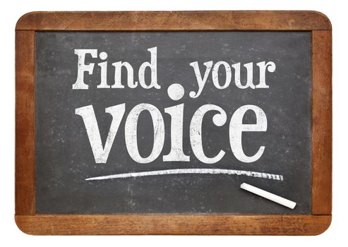 find your voice sign - white chalk text  on a vintage slate blackboard