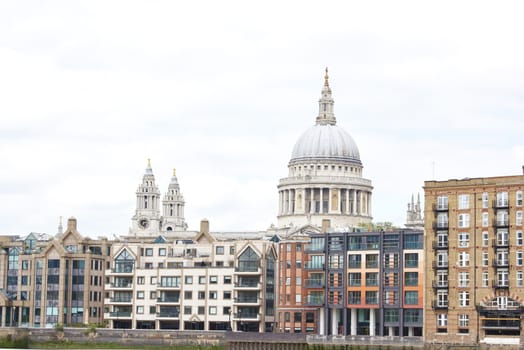 LONDON, UK - JUNE 23: Dome of Saint Paul's cathedral surrounded by lower buildings, seen from Blackfriars. June 23, 2015 in London.