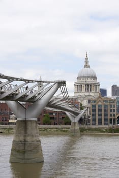 LONDON, UK - JUNE 23: Dome of Saint Paul's cathedral with Millennium Bridge in the foreground. June 23, 2015 in London.