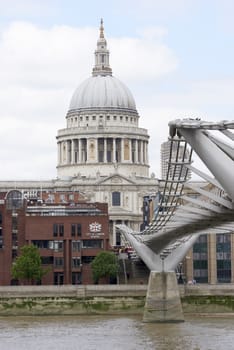 LONDON, UK - JUNE 23: Dome of Saint Paul's cathedral, with Millennium Bridge in the foreground. June 23, 2015 in London.