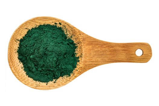 Nutrient-rich organic chlorella powder on a wooden spoon, isolated on white, top view