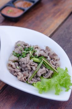 Blanched beef served with fresh green vegetable