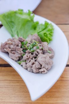 Blanched beef served with fresh green vegetable