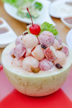 Fresh Fruit Salad with cream sauce in Cantaloupe Bowl