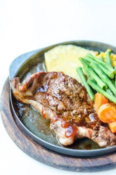 Grilled Steak on Cast Iron Pan with vegetables on the Side