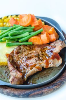 Grilled Steak on Cast Iron Pan with vegetables on the Side