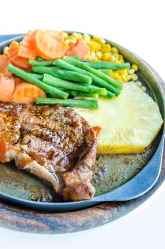 Grilled Steak on Cast Iron Pan with vegetables on the Side