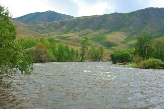 The Tempestuous mountain river in mountain.Year landscape