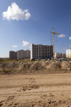   a construction site on which construction of a new multystoried house is carried out.