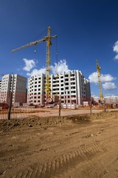   a construction site on which construction of a new multystoried house is carried out.