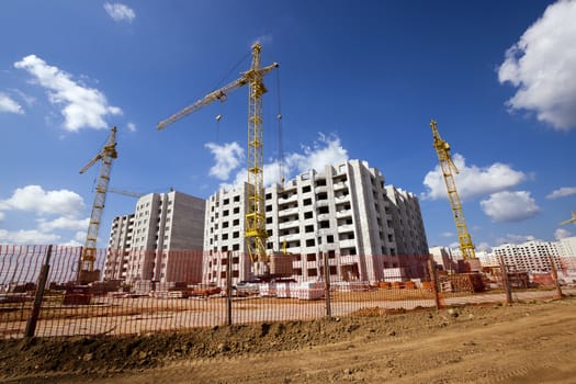   a construction site on which construction of a new multystoried house is carried out.