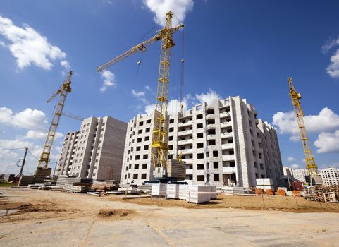  a construction site on which construction of a new multystoried house is carried out.