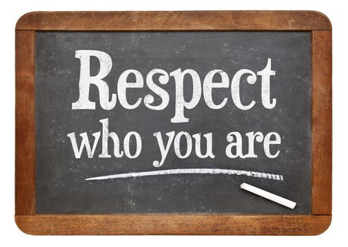 Respect who you are - motivational advice  on a vintage slate blackboard