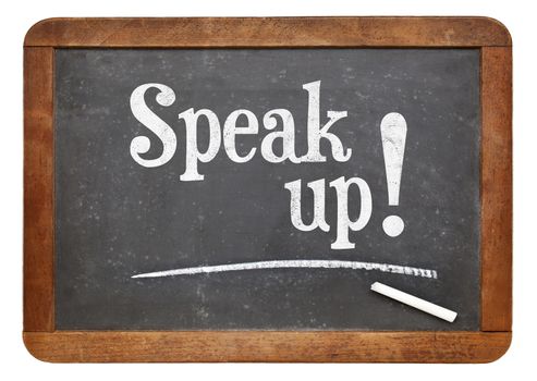 Speak up encouragement - motivational text  on a vintage slate blackboard