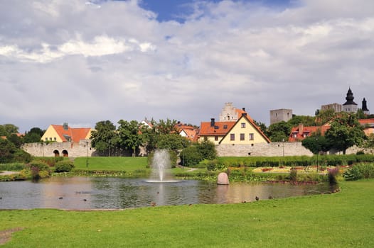 Almedalen and the old city walls of Visby, Sweden. Almedalen was originally the medieval harbour of Visby.