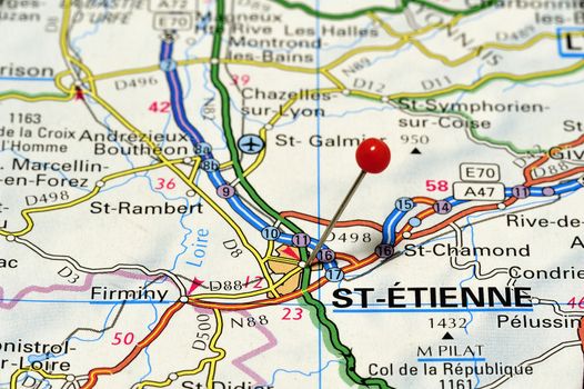 Close-up of the French town of St-Étienne in France on a road map photographed from above