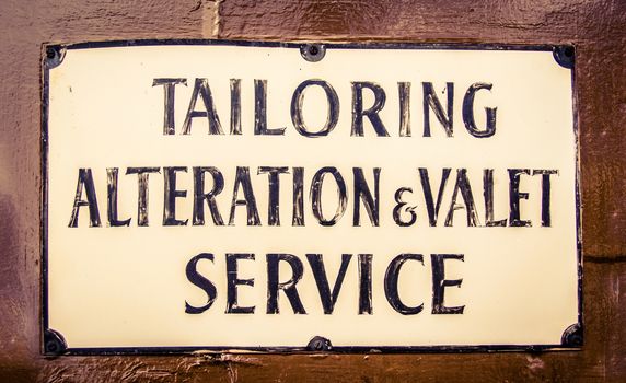 A Vintage Sign For A Tailor And Valet In London England