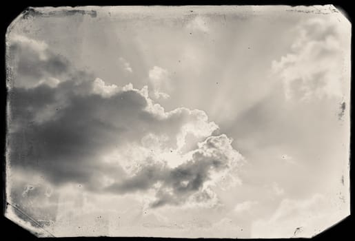 Vintage sky background with dark border and retro texture.