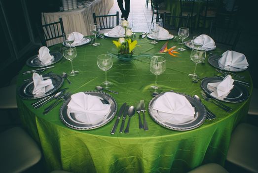 Photograph of an elegant table with silver clutery and wineglasses