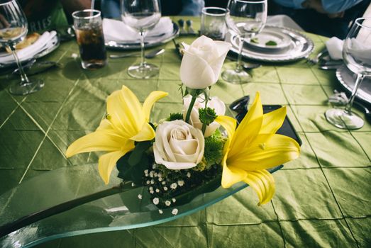 Photograph of a floral arrangement on an elegant table