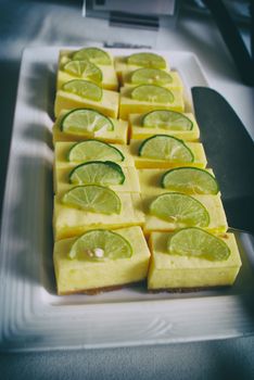 Photograph of a plate with a lemon pie dessert