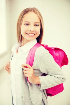 education and school concept - happy and smiling teenage girl with school bag