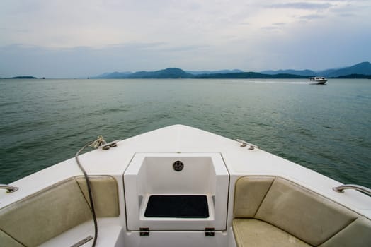 boat in water heading to coast