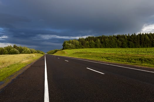   the highway in storm, thunderstorm weather. Belarus